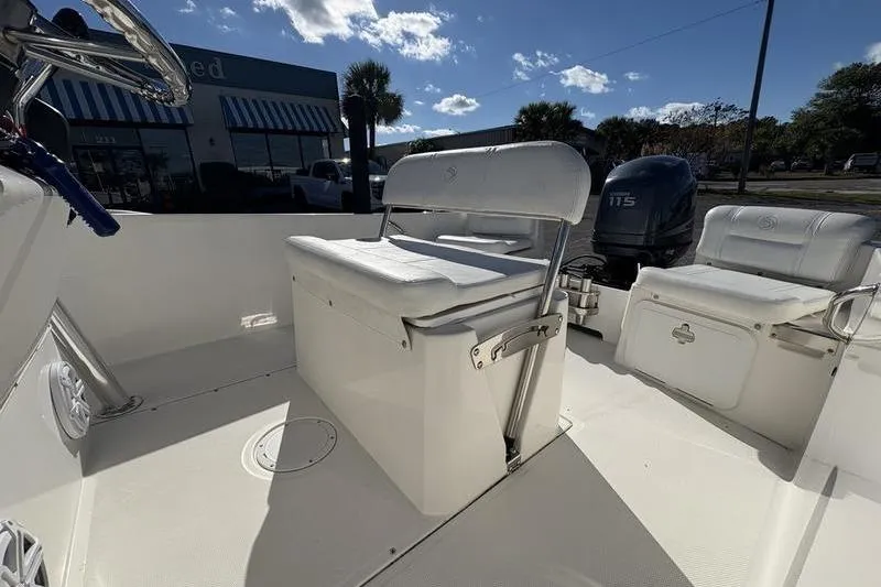 Slide: The Image of 2008 Edgewater 170CC boat interior with seating and outboard motor. - 10