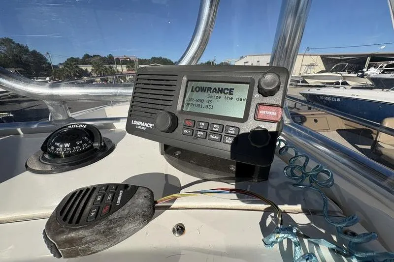 Slide: The Image of 2008 Edgewater 170CC boat dashboard with Lowrance radio and compass. - 16