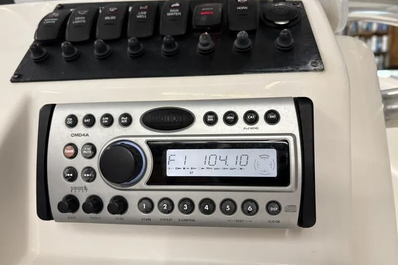 Slide: The Image of 2008 Edgewater 170CC boat dashboard with radio and control panel. - 17