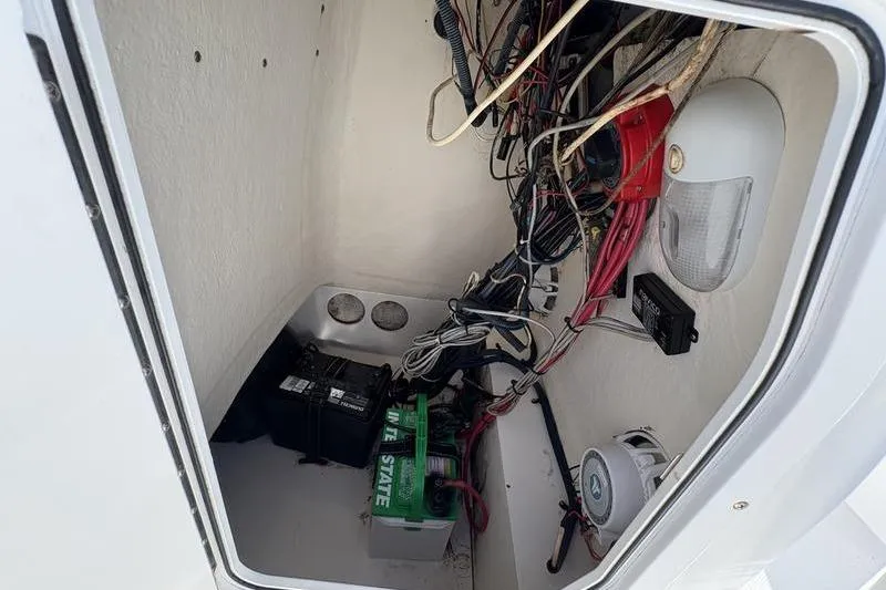 Slide: The Image of 2008 Edgewater 170CC boat wiring and battery compartment interior view. - 20