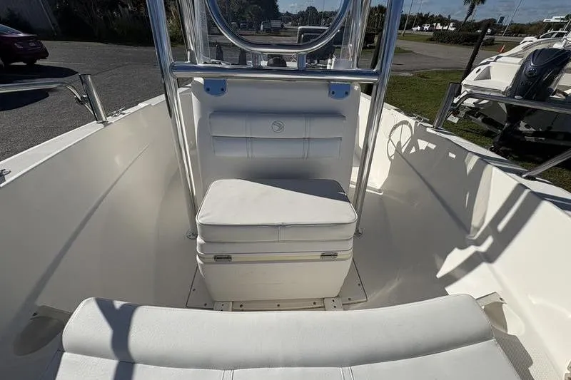 Slide: The Image of 2008 Edgewater 170CC boat interior with seating and steering console. - 23