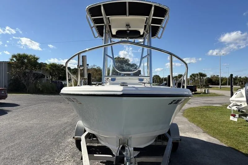 Slide: The Image of 2008 Edgewater 170CC boat on trailer under clear blue sky. - 6