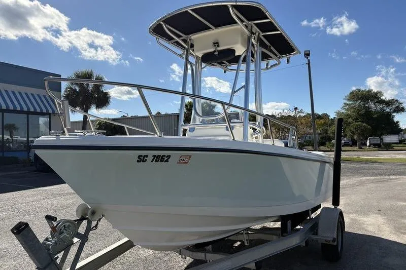 Slide: The Image of 2008 Edgewater 170CC boat on trailer under clear blue sky. - 7