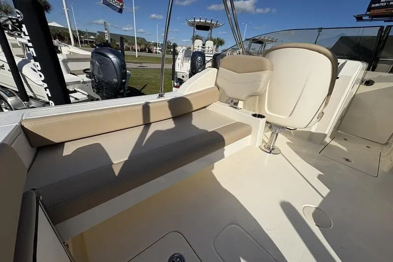 Slide: The Image of 2026 Scout 222 Dorado boat interior with beige seating and modern design. - 11