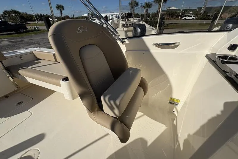 Slide: The Image of 2026 Scout 222 Dorado boat interior with beige seating and modern design. - 14