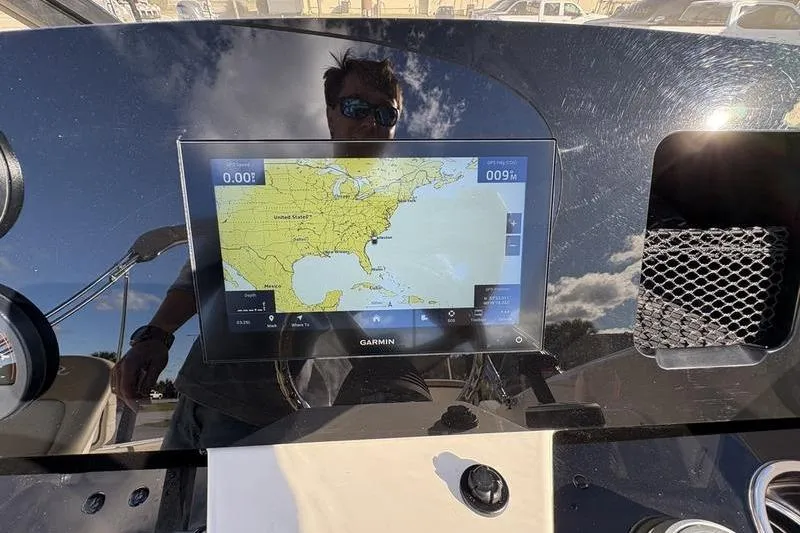 Slide: The Image of Garmin navigation display on 2026 Scout 222 Dorado boat dashboard, showing U.S. East Coast map. - 18