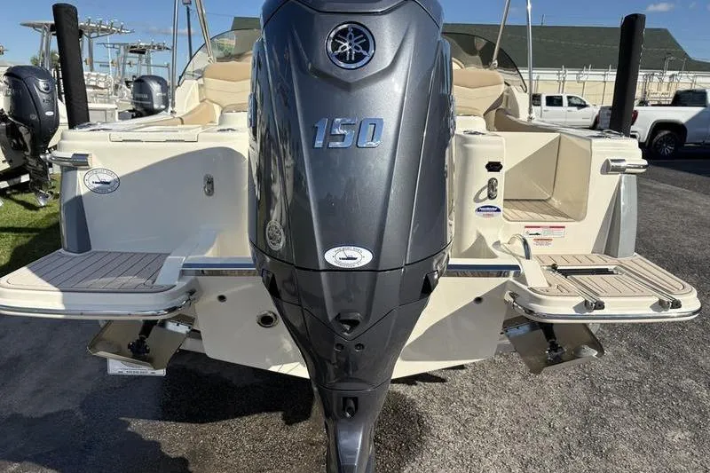Slide: The Image of 2026 Scout 222 Dorado boat with Yamaha 150 outboard motor, rear view. - 2