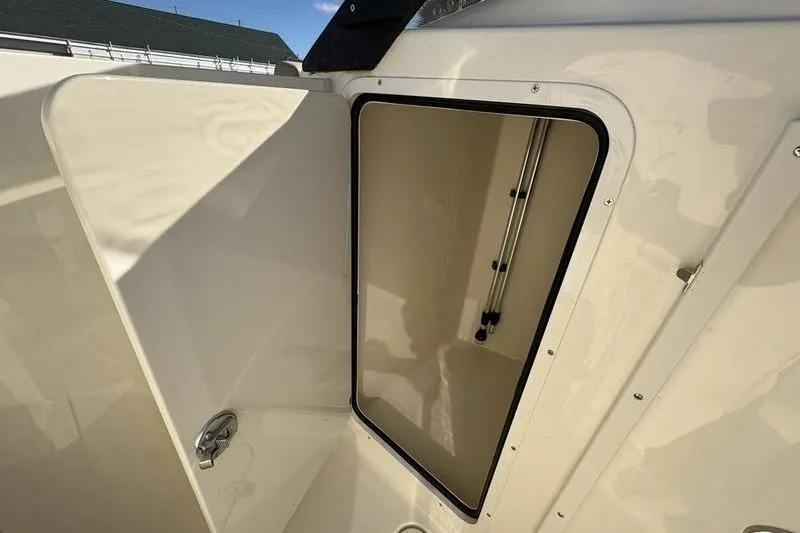 Slide: The Image of Open storage compartment on 2026 Scout 222 Dorado boat, showcasing interior space. - 21