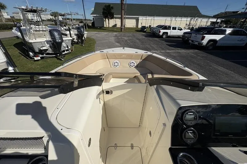 Slide: The Image of 2026 Scout 222 Dorado boat interior with dashboard and seating area. - 24