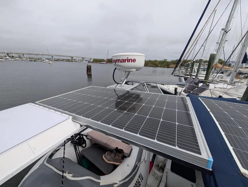 Slide: The Image of Solar panels on a 2003 Beneteau Oceanis 473 sailboat, docked in a marina. - 41