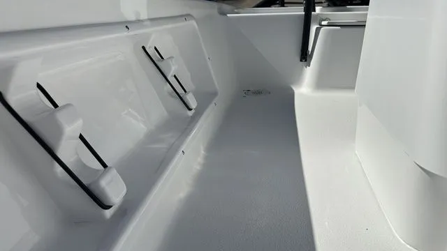 Slide: The Image of Interior of ALK2 Powerboats 17HS 2026, white surface and seating area. - 38