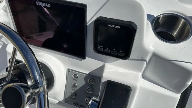Slide: The Image of ALK2 Powerboats 17HS 2026 console with Simrad and Suzuki devices. - 45