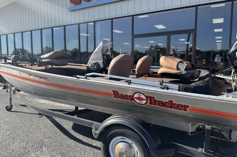 Slide: The Image of 2018 Tracker Bass Tracker 40th Anniversary Heritage Edition boat on trailer outside store. - 13