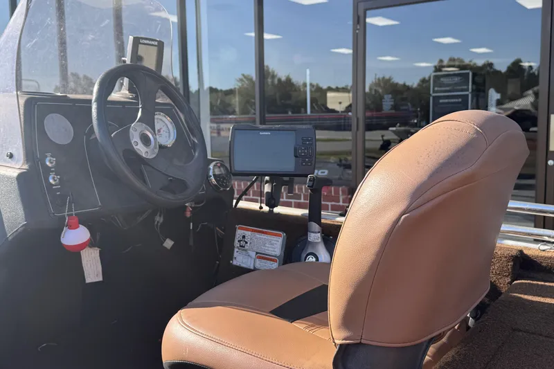 Slide: The Image of 2018 Tracker Bass Tracker 40th Anniversary Heritage Edition boat interior with steering wheel and electronics. - 8