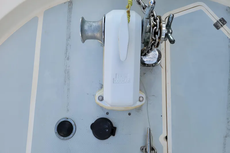 Slide: The Image of Anchor windlass on 1989 Bayliner 3888 Motoryacht deck, featuring Muir Cougar model. - 12