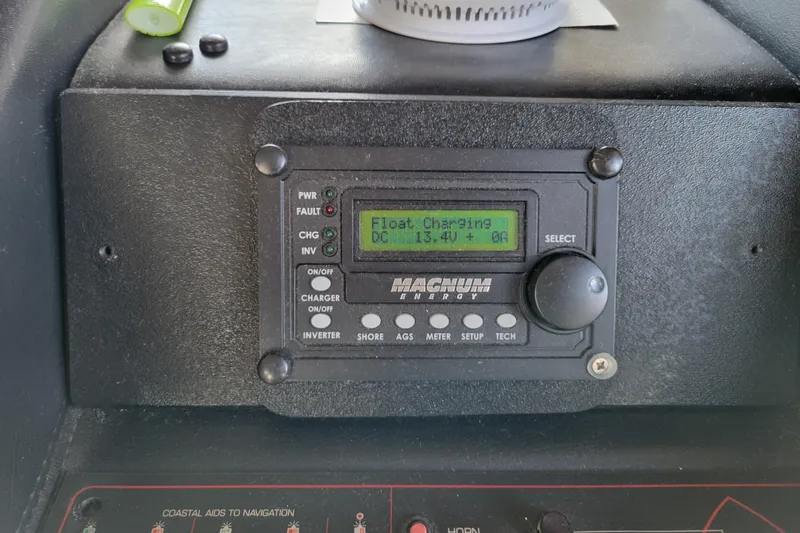 Slide: The Image of Control panel on 1989 Bayliner 3888 Motoryacht displaying charging status. - 29