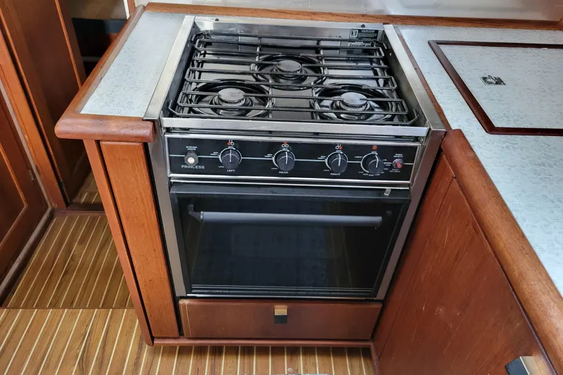 Slide: The Image of 1989 Bayliner 3888 Motoryacht kitchen with a compact stove and oven. - 37