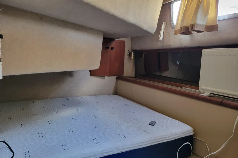 Slide: The Image of Interior cabin of 1989 Bayliner 3888 Motoryacht with bed and window. - 39