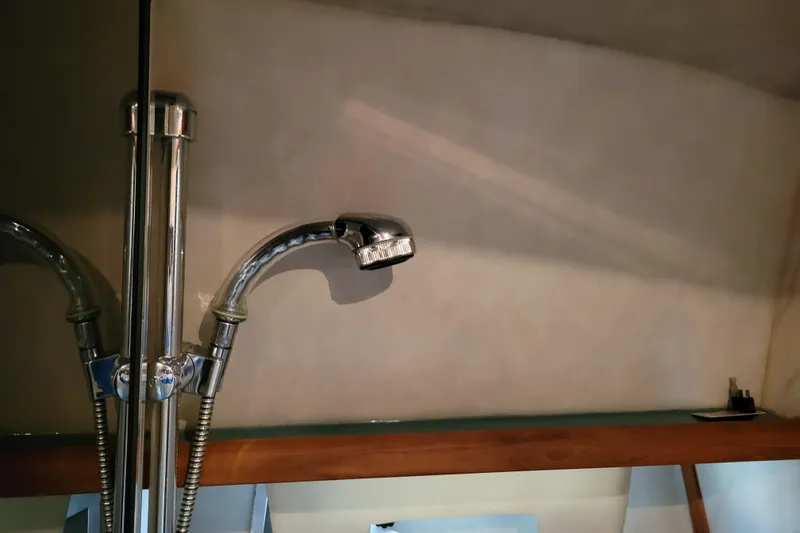 Slide: The Image of Chrome faucet in the bathroom of a 1989 Bayliner 3888 Motoryacht. - 43