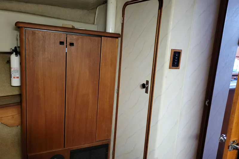 Slide: The Image of Interior of 1989 Bayliner 3888 Motoryacht with wooden cabinets and door. - 47