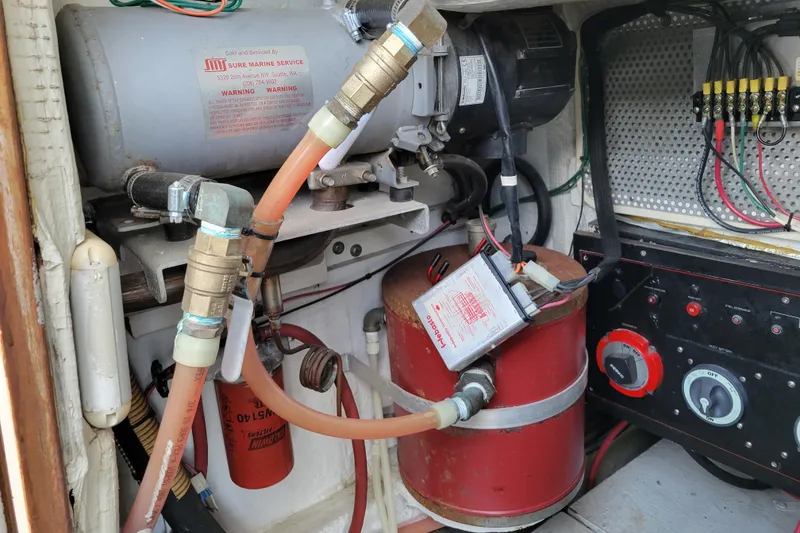 Slide: The Image of Engine room of 1989 Bayliner 3888 Motoryacht with mechanical components and wiring. - 52