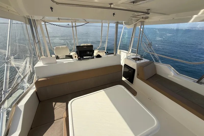 Slide: The Image of 1998 Riviera Convertible boat interior with seating and ocean view. - 15