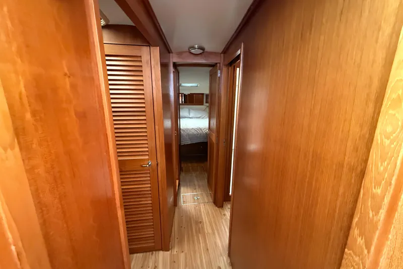 Slide: The Image of 1998 Riviera Convertible interior hallway with wooden paneling and bedroom view. - 24