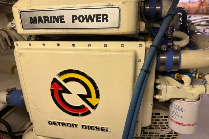 Slide: The Image of Marine engine labeled "Marine Power" and "Detroit Diesel" in a 1998 Riviera Convertible. - 32