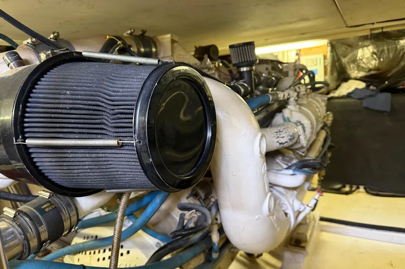 Slide: The Image of Engine compartment of a 1998 Riviera Convertible, showcasing air filter and components. - 33