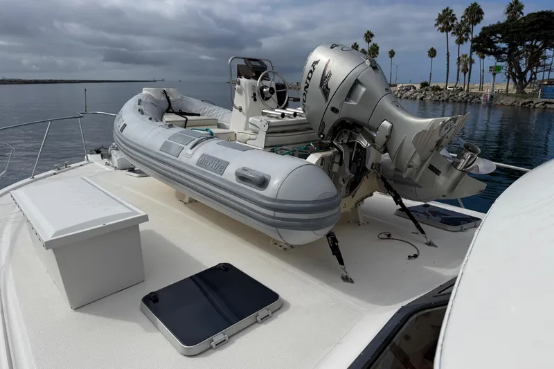 Slide: The Image of 1998 Riviera Convertible yacht with inflatable dinghy and outboard motor on deck. - 5
