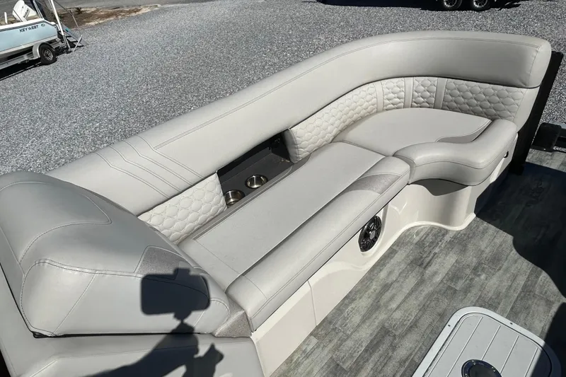 Slide: The Image of 2023 Crest Caribbean Platinum 230 boat interior with luxurious seating and modern design. - 10