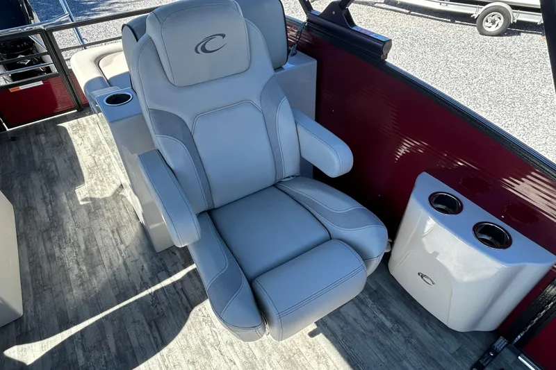 Slide: The Image of 2023 Crest Caribbean Platinum 230 dashboard with steering wheel and control panel. - 13