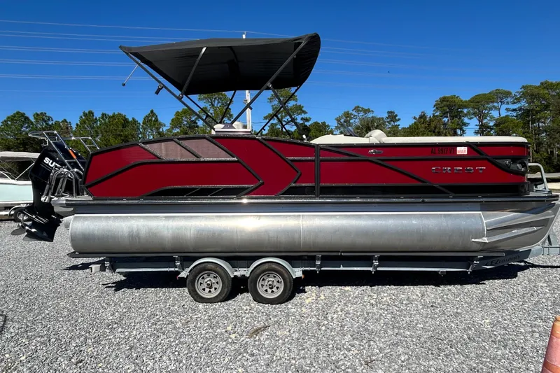 Slide: The Image of 2023 Crest Caribbean Platinum 230 pontoon boat with Suzuki outboard motor on trailer. - 4