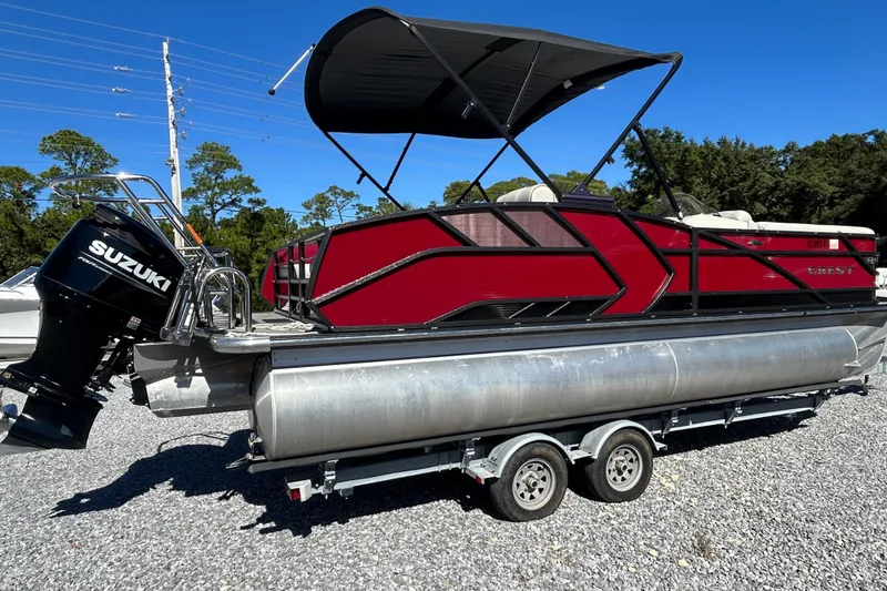 Slide: The Image of 2023 Crest Caribbean Platinum 230 pontoon boat on display, featuring spacious seating and sleek design. - 5