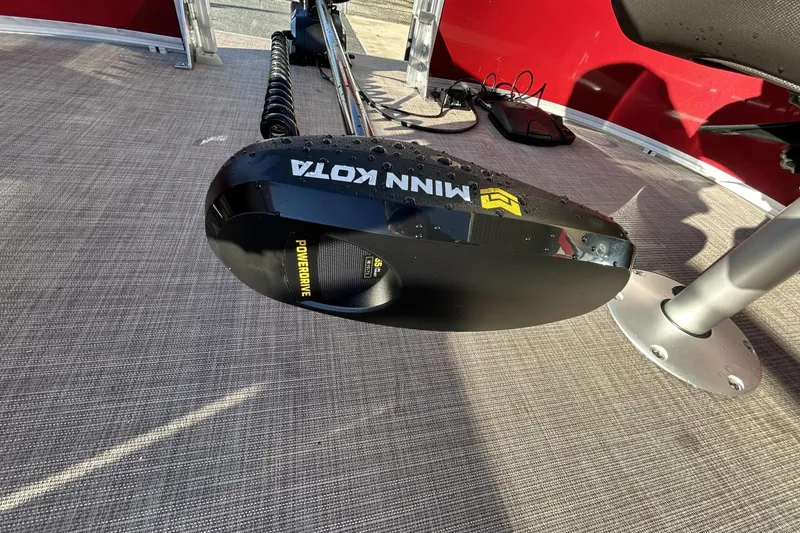 Slide: The Image of 2024 Sun Tracker Bass Buggy 16 XL Select with Minn Kota PowerDrive motor on deck. - 8