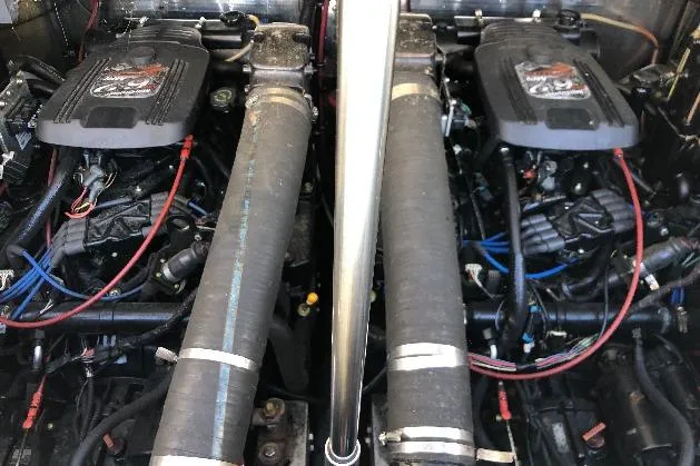 Slide: The Image of Twin engines of a 2002 Shamrock 290 Walkaround boat, showcasing detailed components. - 22