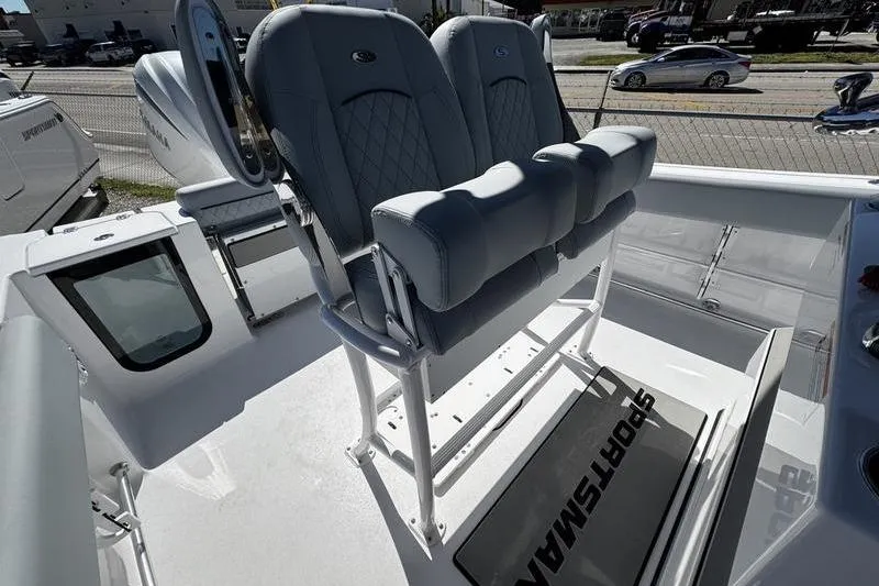 Slide: The Image of 2026 Sportsman Open 232 Center Console boat with cushioned seating and modern design. - 16