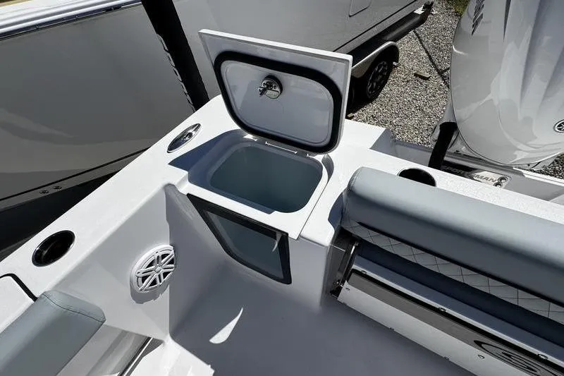 Slide: The Image of 2026 Sportsman Open 232 Center Console boat interior with open storage compartment. - 17