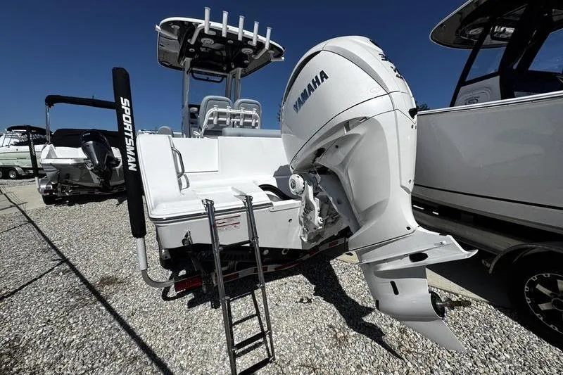 Slide: The Image of 2026 Sportsman Open 232 Center Console boat with Yamaha outboard engine. - 2