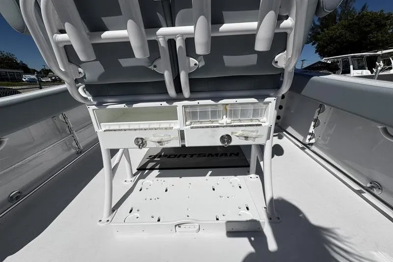 Slide: The Image of 2026 Sportsman Open 232 Center Console boat interior with storage compartments. - 21