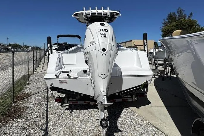 Slide: The Image of 2026 Sportsman Open 232 Center Console boat with powerful 300 V6 engine, rear view. - 3
