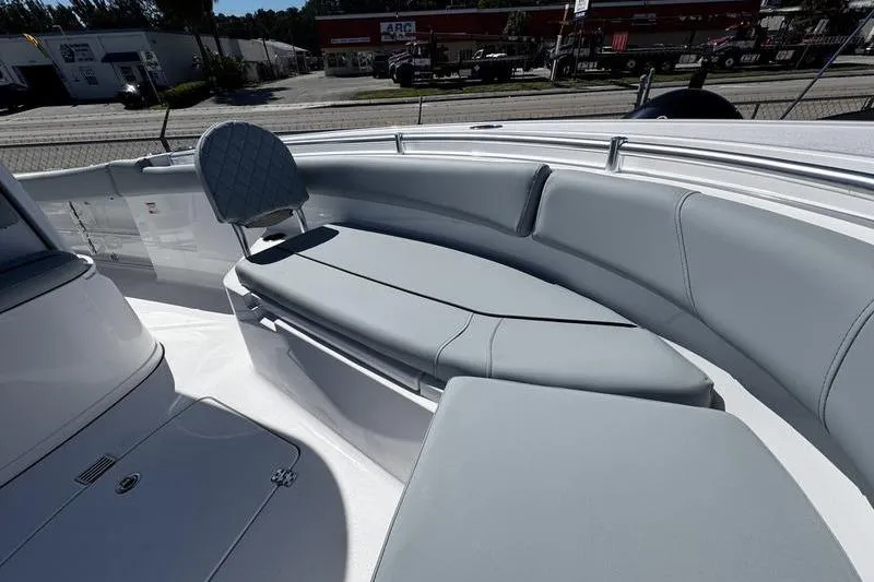 Slide: The Image of 2026 Sportsman Open 232 Center Console boat with gray seating and sleek design. - 5