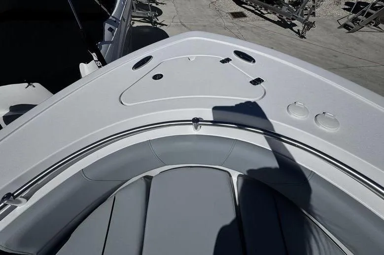 Slide: The Image of 2026 Sportsman Open 232 Center Console boat interior with seating and storage compartments. - 7