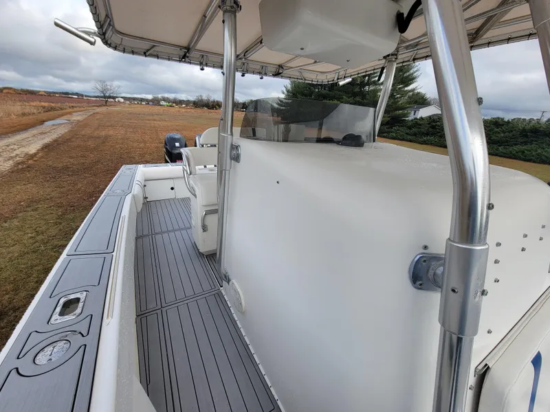 Slide: The Image of 1996 Venture 34 Center Console boat with spacious deck and canopy. - 22
