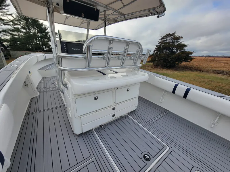 Slide: The Image of 1996 Venture 34 Center Console boat with sleek deck and seating. - 25