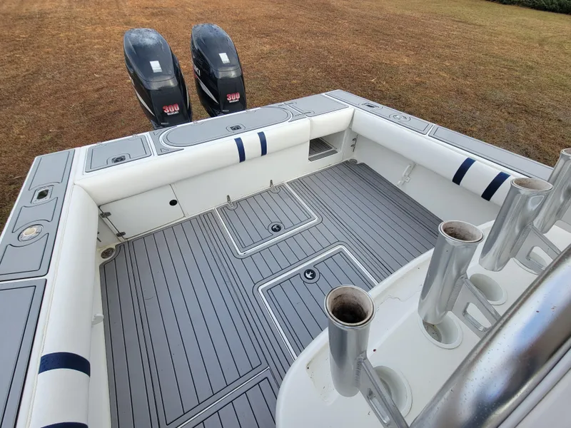 Slide: The Image of 1996 Venture 34 Center Console boat with dual engines and spacious deck. - 28