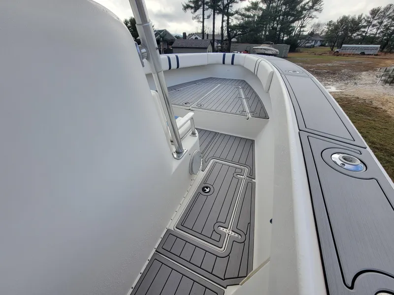 Slide: The Image of 1996 Venture 34 Center Console boat deck with sleek design and modern fittings. - 29