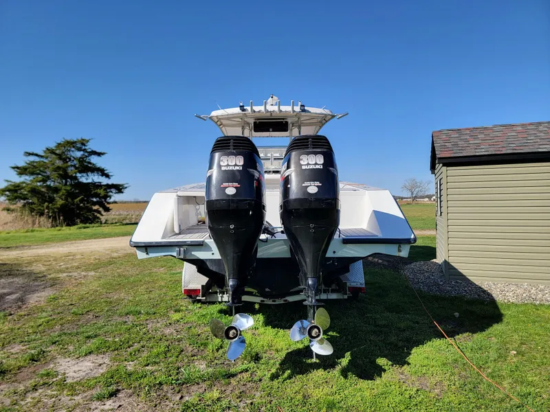 Slide: The Image of 1996 Venture 34 Center Console boat with twin 300 horsepower Suzuki engines. - 8