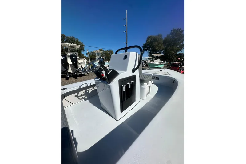Slide: The Image of 2026 Delta Boatworks Delta D18 boat with sleek console design under clear blue sky. - 18