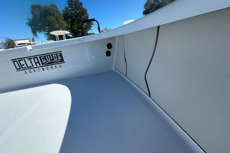 Slide: The Image of 2026 Delta Boatworks Delta D18 interior with sleek design and Delta Guide Series branding. - 24
